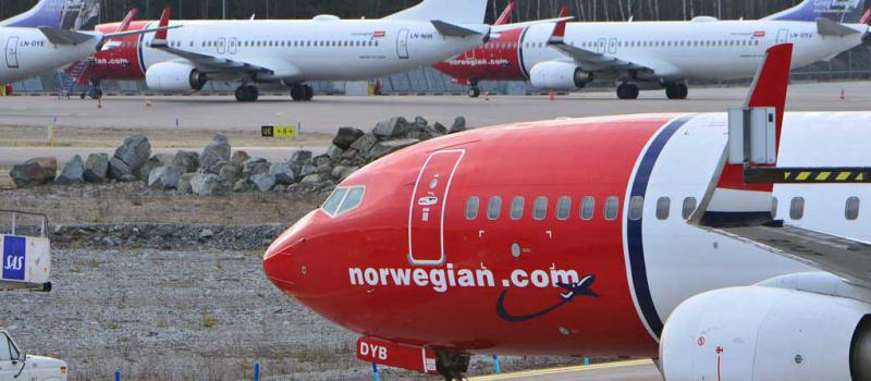 Aviones de la aerolínea de bajo costo Norwegian Air Shuttle, en el aeropuerto de Estocolmo. Las aerolíneas prevén recibir este año 1 850 aviones, según la IATA. Foto: Johan Nilsson / AFP
